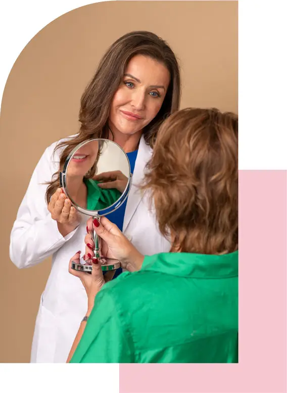 Photo of Dr. Heidi Harrington with a woman looking in a mirror